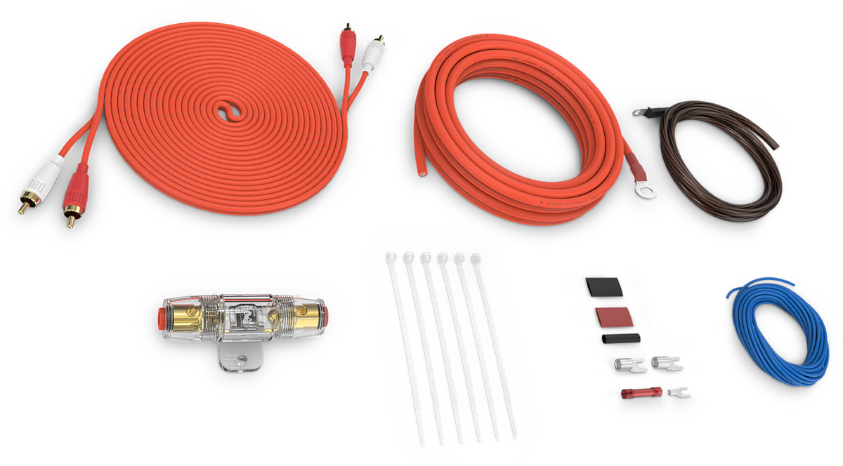 Kit di collegamento completo per amplificatore o subwoofer attivo auto, modello JBL AK-82CA, con cavi rca del segnale audio, alimentazione e massa, remote, fusibile e portafusibile, accessori di installazione. Vista principale del contenuto completo compreso nella confezione.